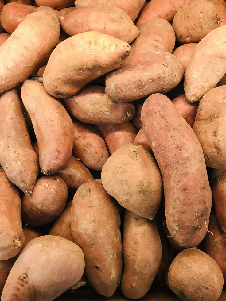 Close-up of fresh sweet potatoes showcasing vibrant color